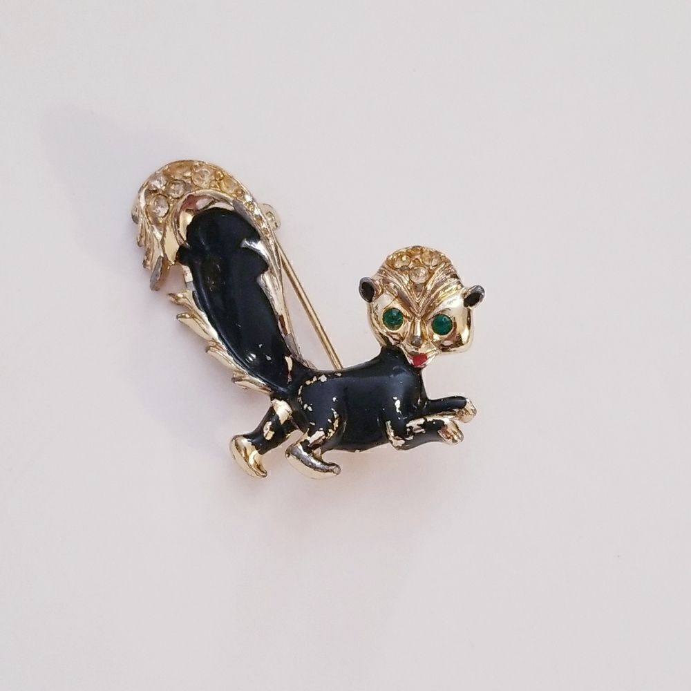 Vintage Gold enamel rhinestone skunk brooch
